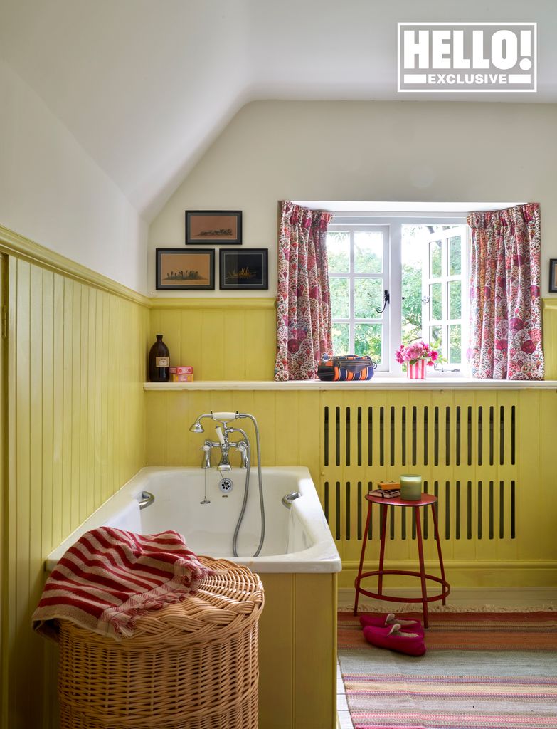 Penelope Chilvers' yellow wood pannelled bathroom at Cotswolds home