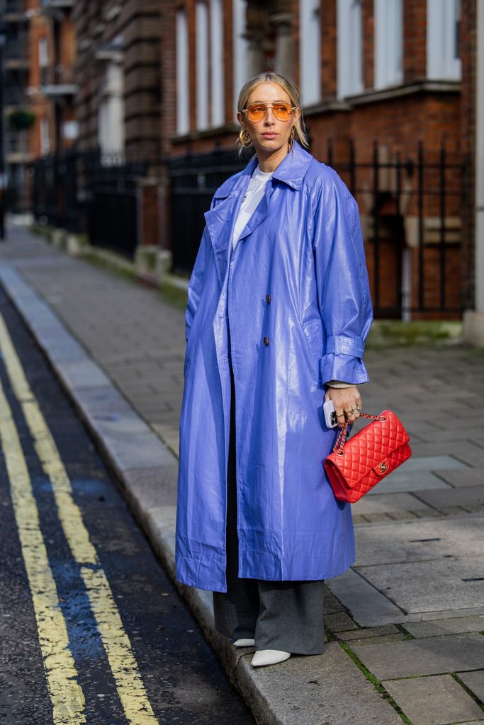 Charlotte Collins served several pops of colour in her oversized purple coat, yellow aviators and red Chanel bag outside Bora Aksu.