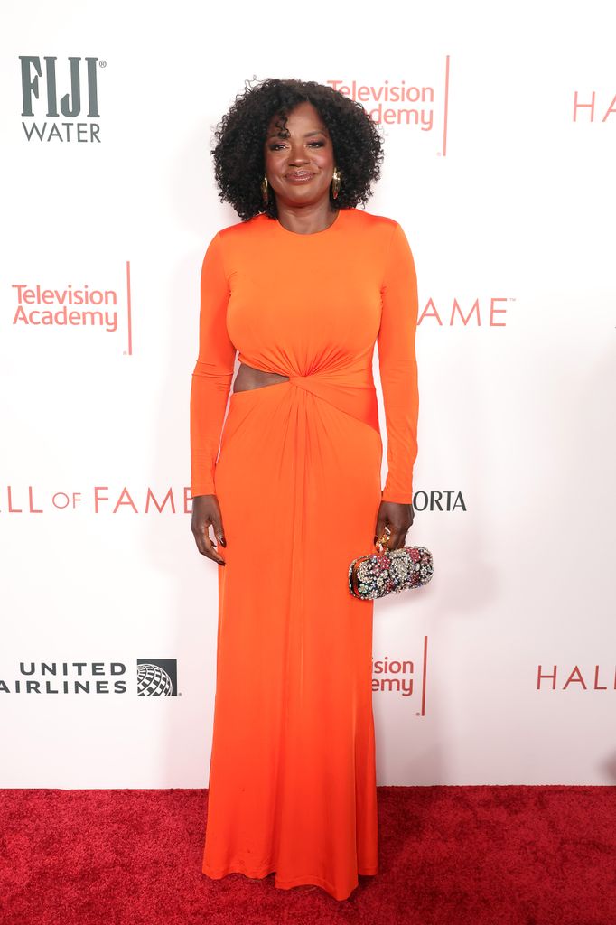 Viola Davis on red carpet in orange dress