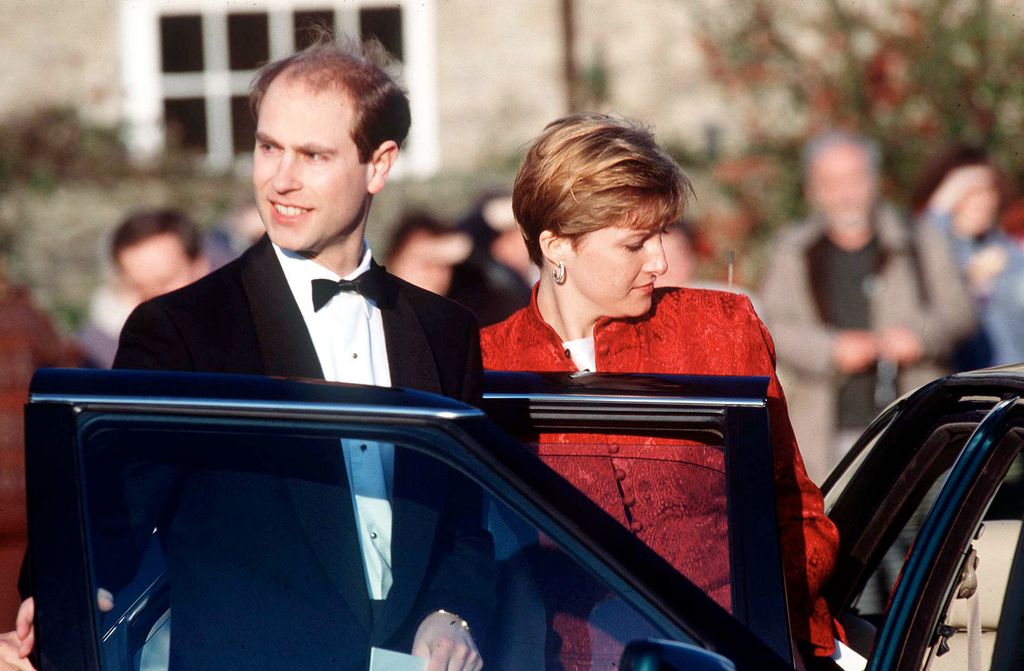 Prince Edward in a black tuxedo and Duchess Sophie in a red outfit