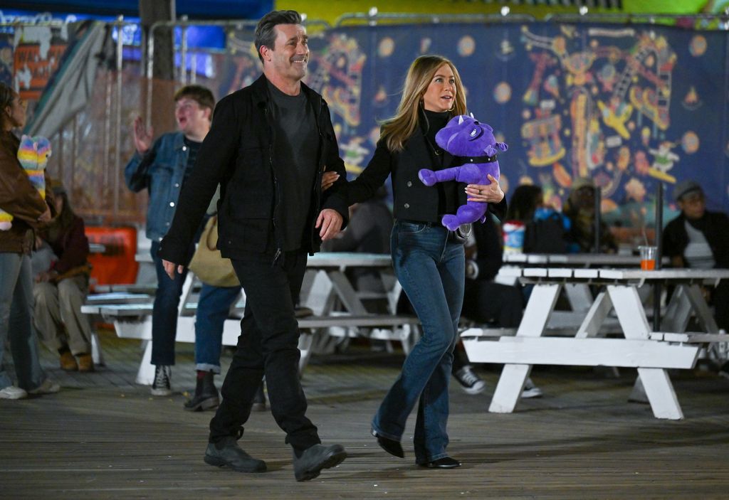 Jon Hamm and Jennifer Aniston are seen filming on location for 'The Morning Show' at Coney Island on September 28, 2022 in New York City