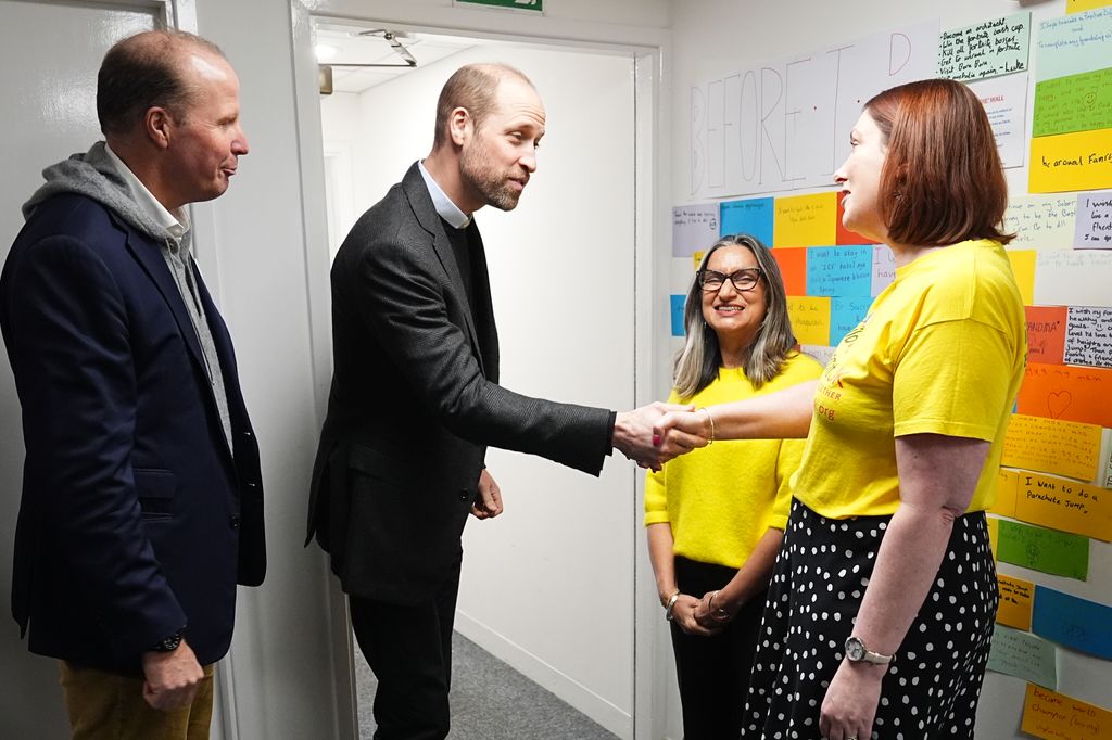 prince william shaking woman's hand