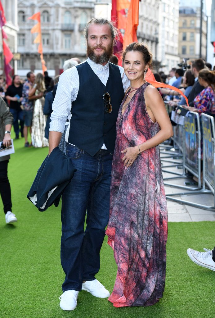 Kara Tointon cradles her baby bump in a pink maxi dress with Marius