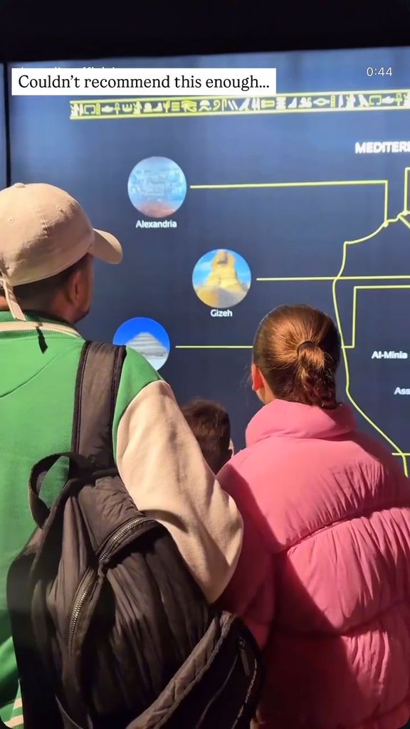 father with two children at exhibition 