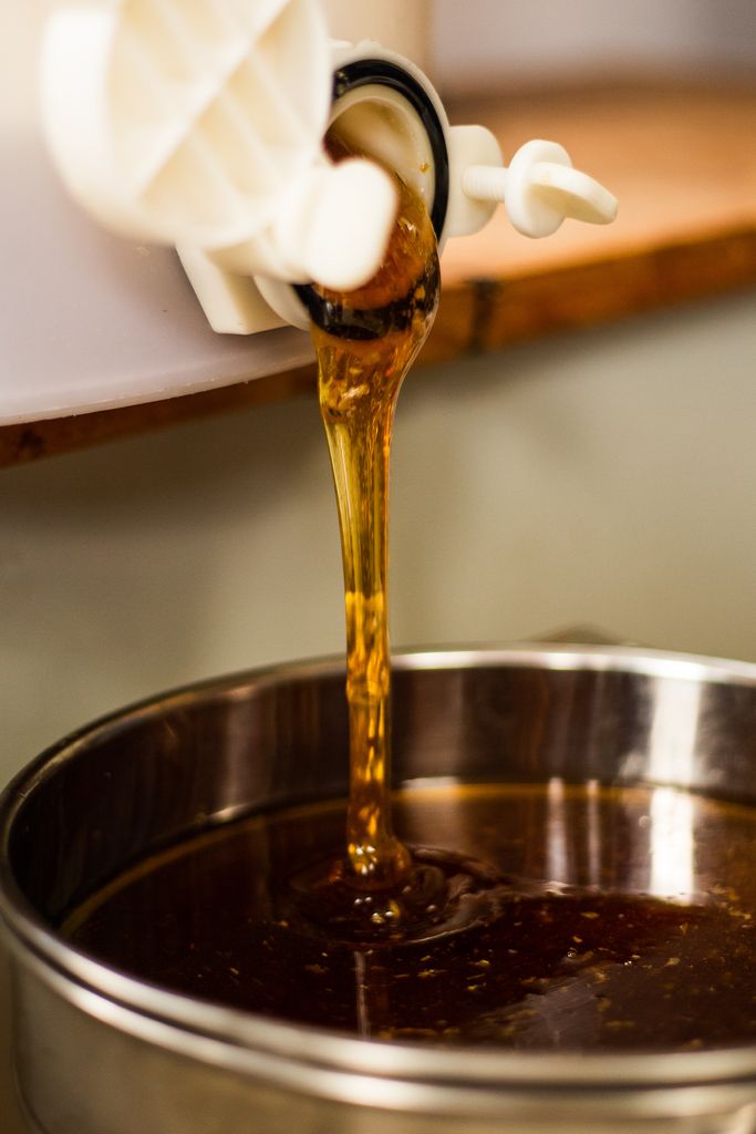 Honey being poured into a bowl