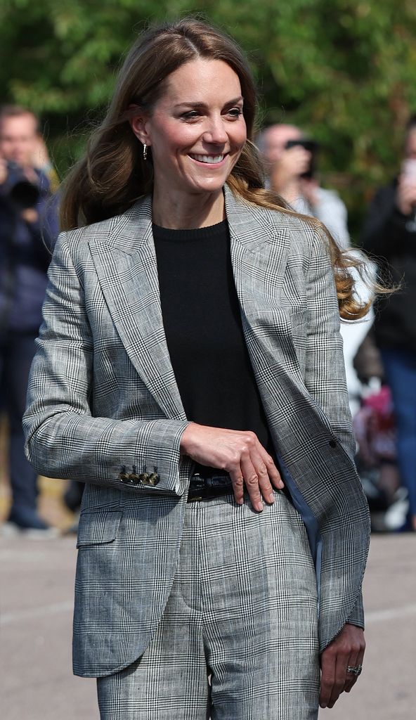 Kate Middleton wearing trouser suit and black top
