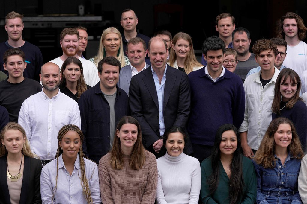 Britain's Prince William, Prince of Wales poses for a group photo with staff members as he visits after visiting last November Earthshot Prize winner and sustainable packaging start-up, Notpla, at their headquarters in London