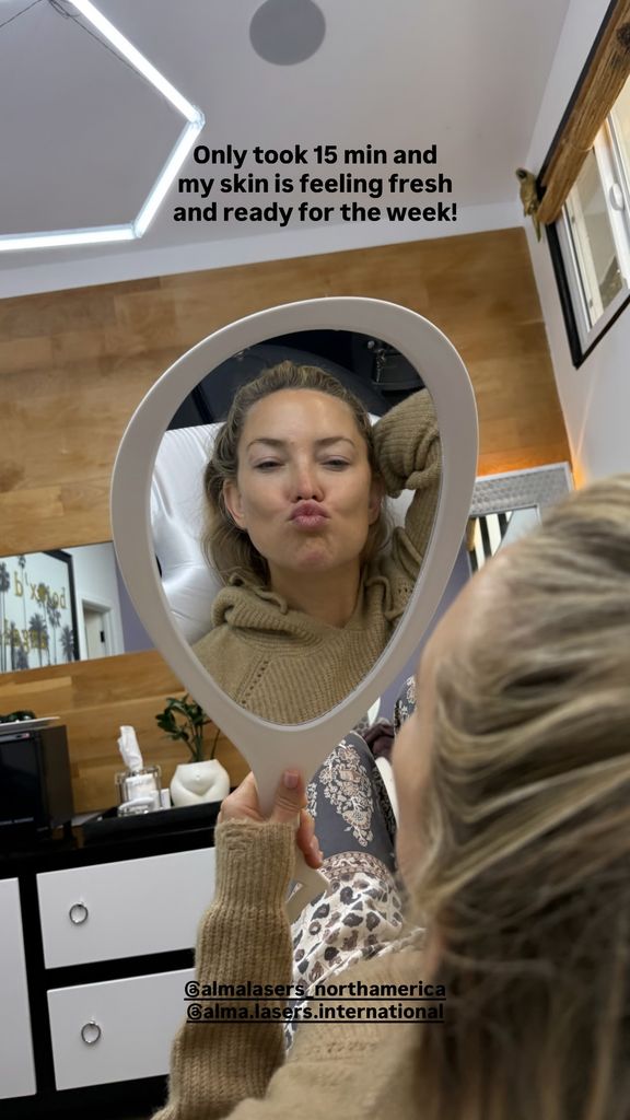 Kate Hudson pouting in hand held mirror