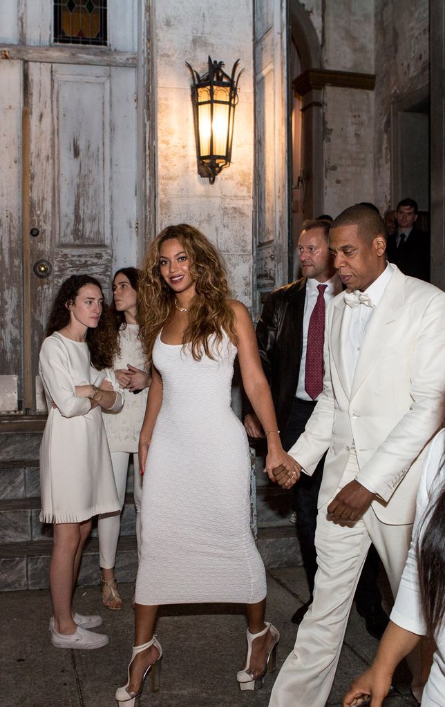 Beyonce with jay-z in white at wedding