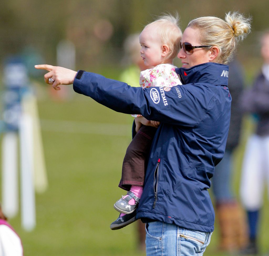 Zara Tindall holding Savannah Phillips