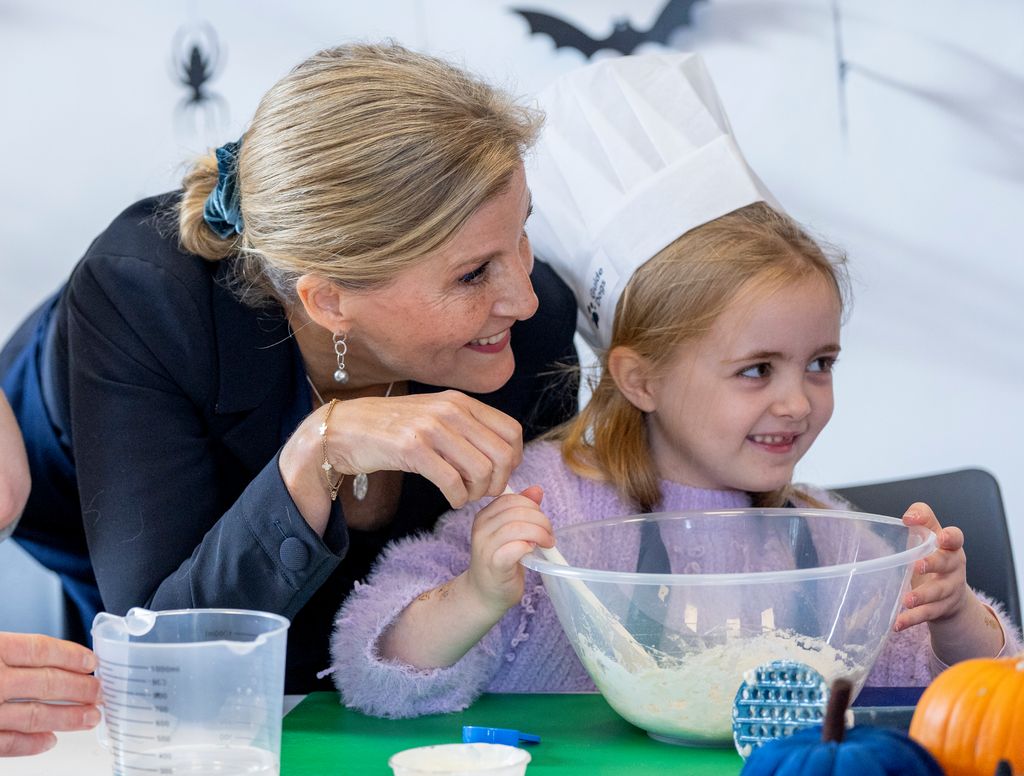 Duchess Sophie helps child to make dog biscuits