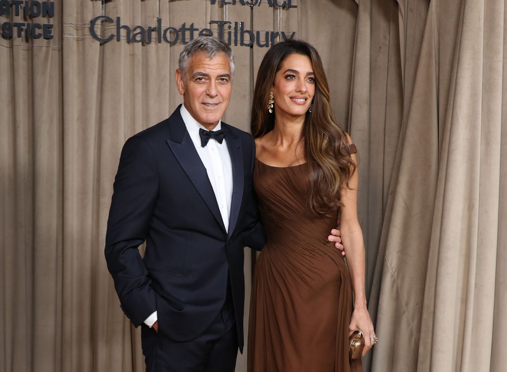 George Clooney and Amal Clooney attend the Clooney Foundation For Justice's The Albies at The Natural History Museum on October 03, 2025 in London, England. 