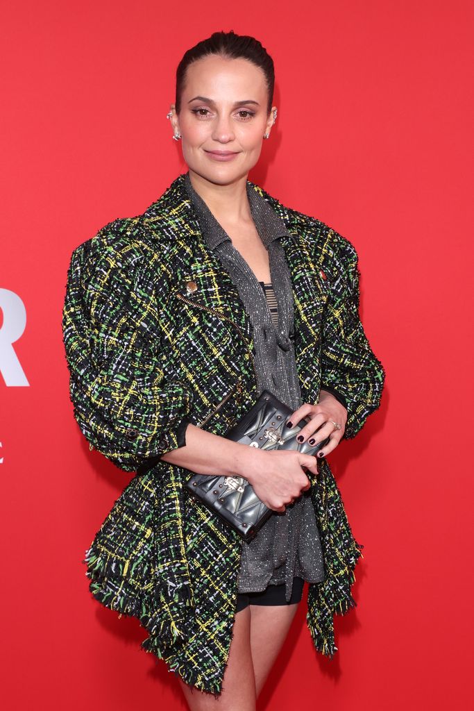 Alicia Vikander in a green outfit