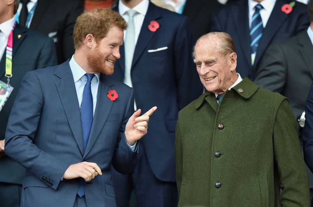 Prince Harry and Prince Philip smiling