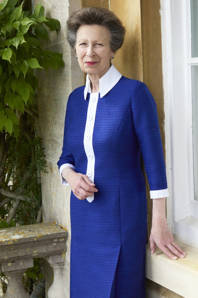 Princess Anne pictured in blue dress outside Gatcombe Park 