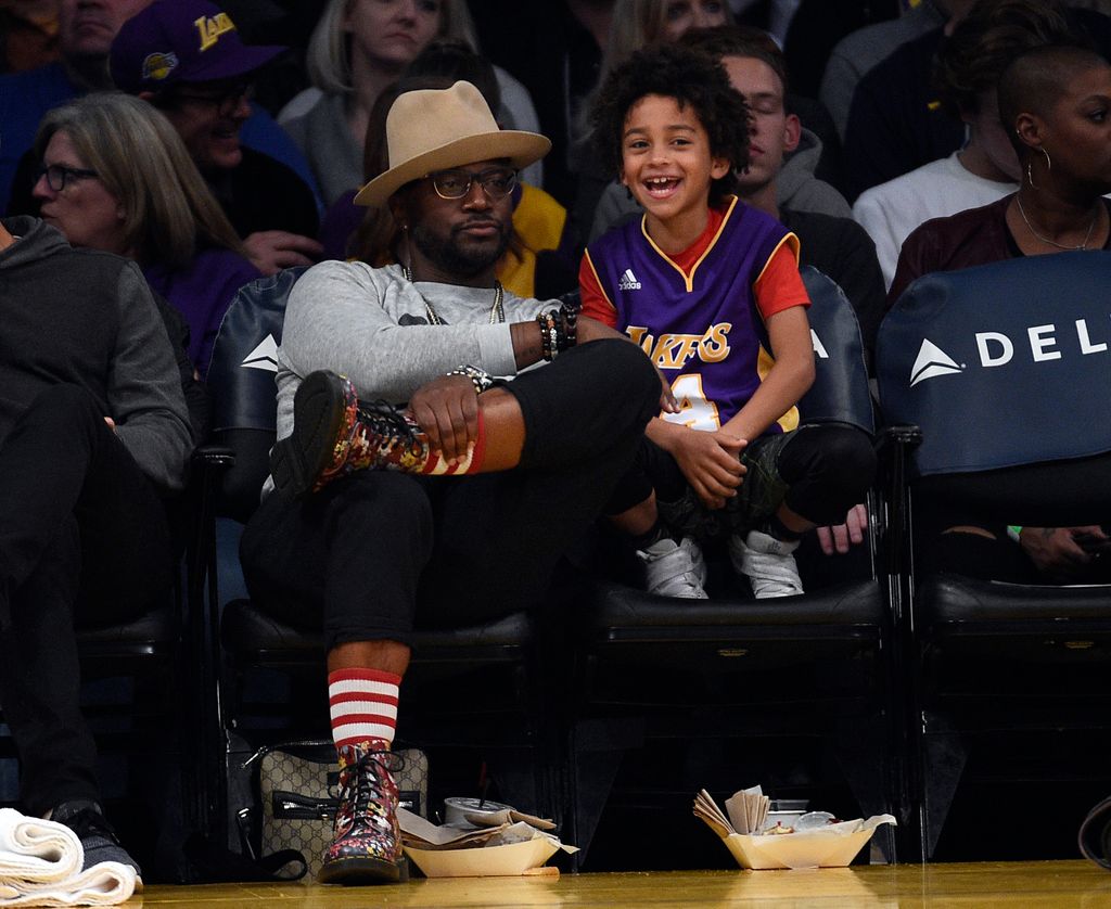 Taye Diggs and his son in 2018 at a basketball game