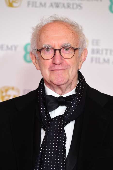 jonathan pryce in bow tie and spotty scarf