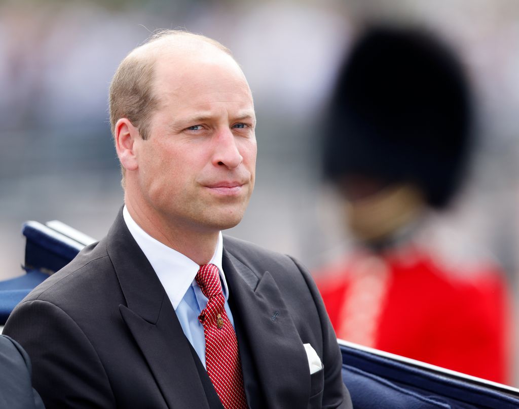 prince william wearing suit in carriage 