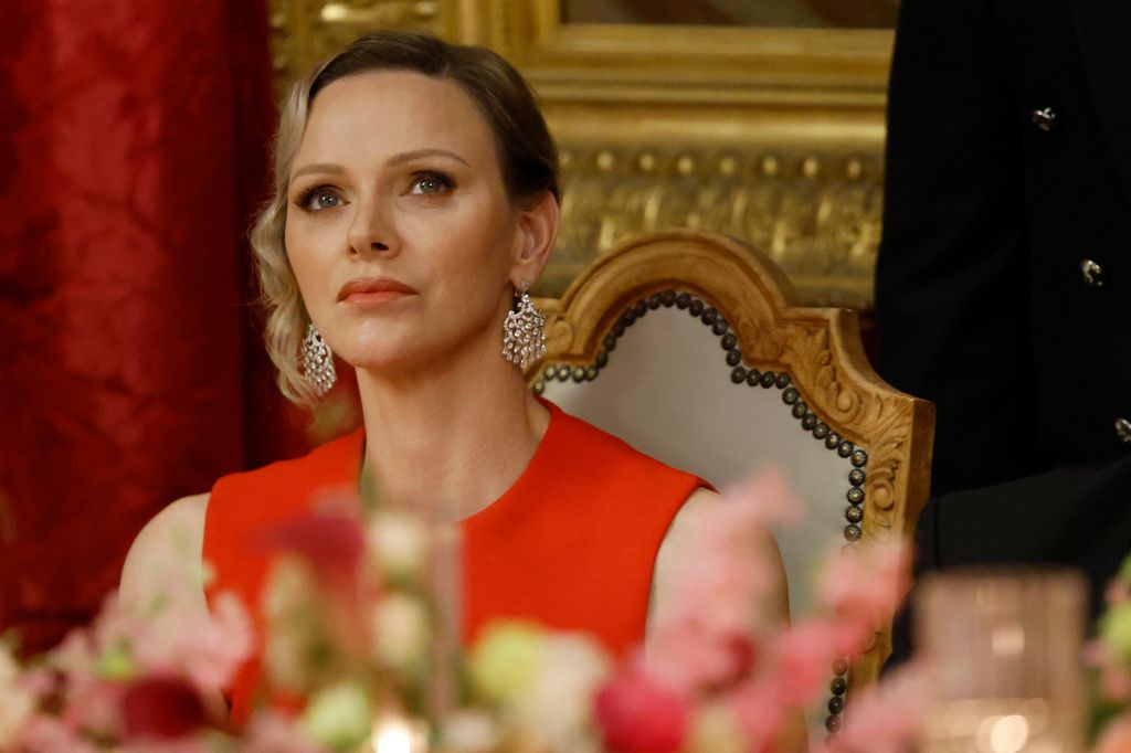Princess Charlene of Monaco listens to speeches at the Prince's Palace during a state dinner as part of France's President two-day state visit in Monaco ahead of the Unoc3 on June 7, 2025. The EU will present the new roadmap at the June 9-13 UN Ocean Conference (UNOC), which is set to draw some 70 heads of state and government to southern France. (Photo by Ludovic MARIN / AFP) (Photo by LUDOVIC MARIN/AFP via Getty Images)          