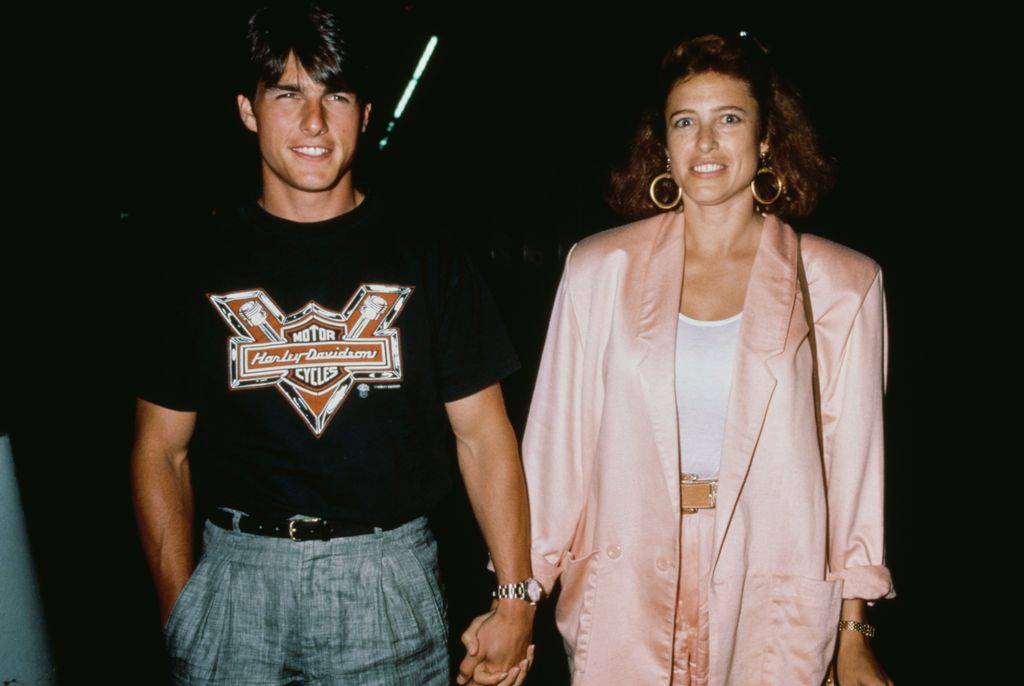 Tom Cruise and Mimi Rogers holding hands