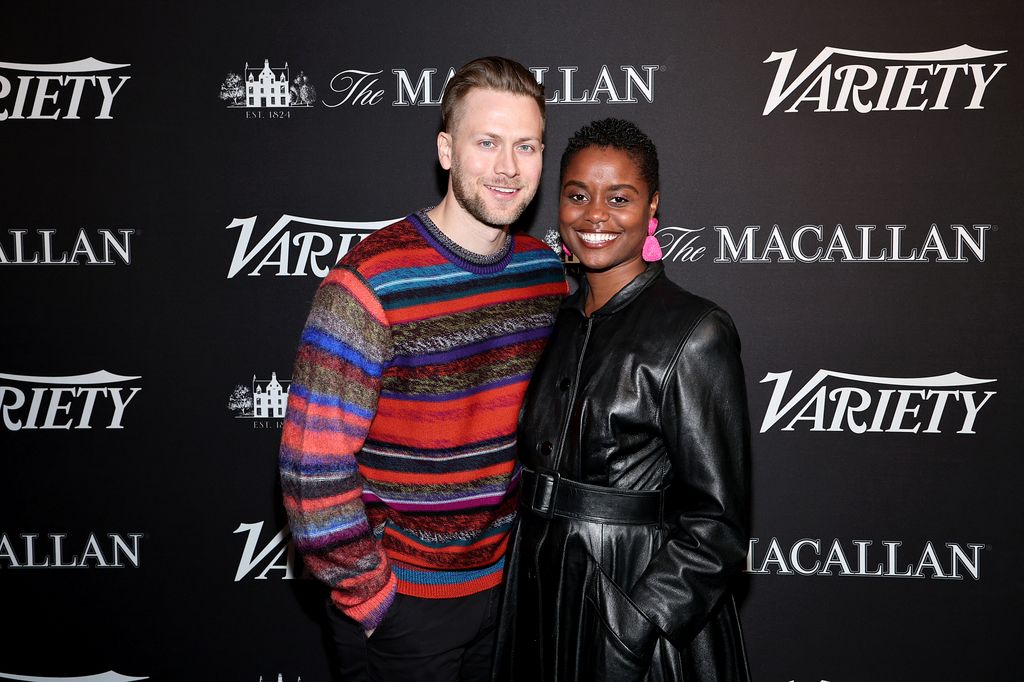 couple posing on red carpet