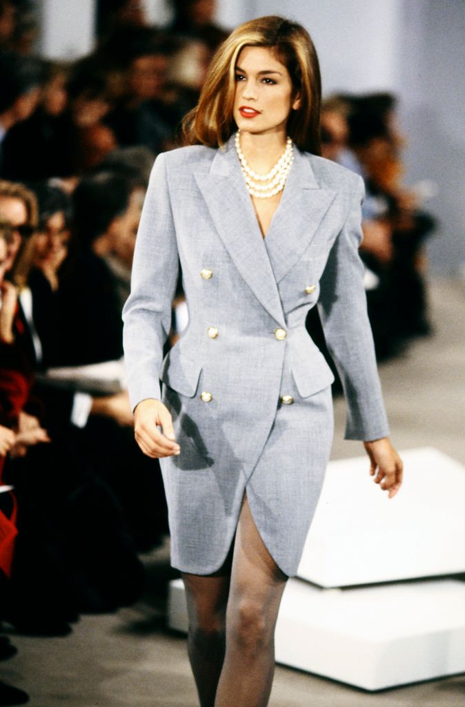 Cindy Crawford walks the runway in the Donna Karan Spring 1992 runway show in a blazer dress