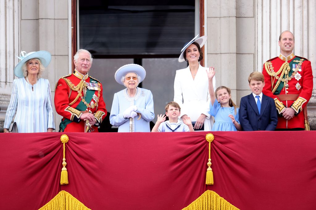 Queen Camilla, King Charles, Queen and Wales family look up from balcony to watch flyover