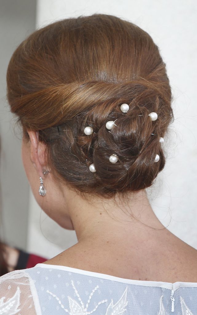 Catherine's hair from behind in bun with pearls