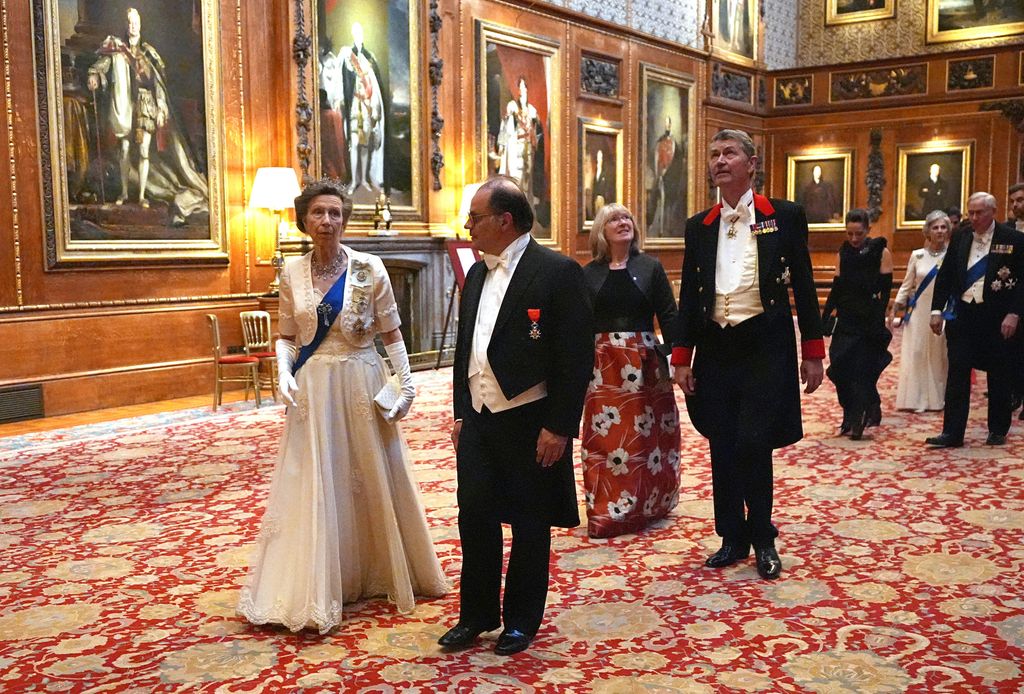 Princess Anne, Princess Royal (L) and Emmanuel Moulin walking through castle