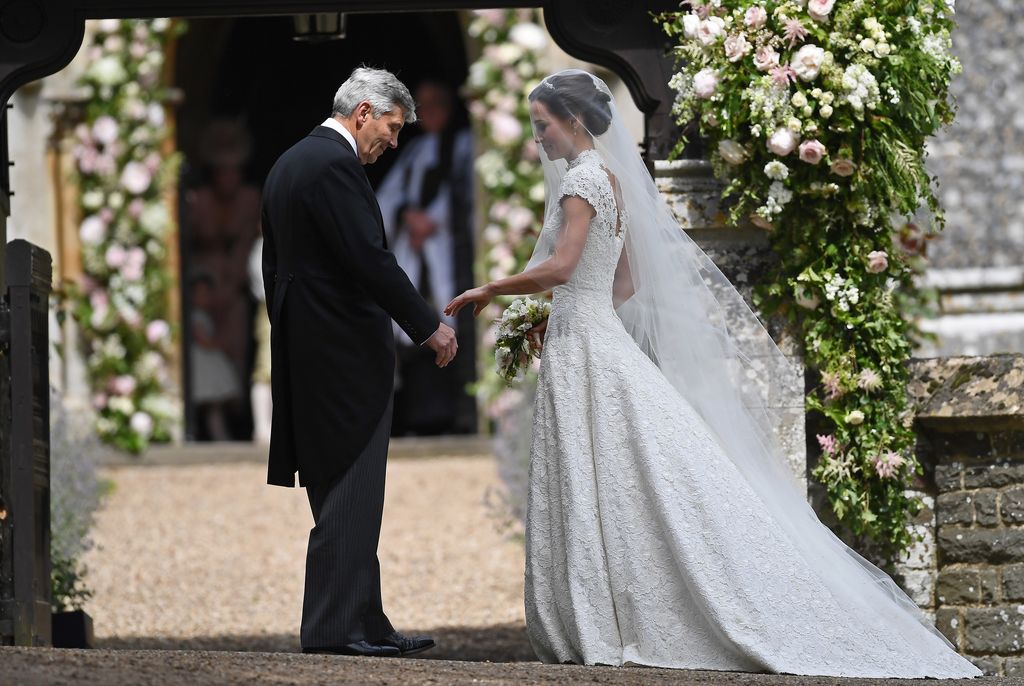 Michael takes Pippa's hand on wedding day