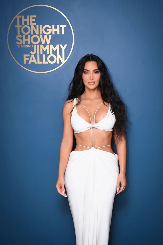 Kim Kardashian poses backstage 