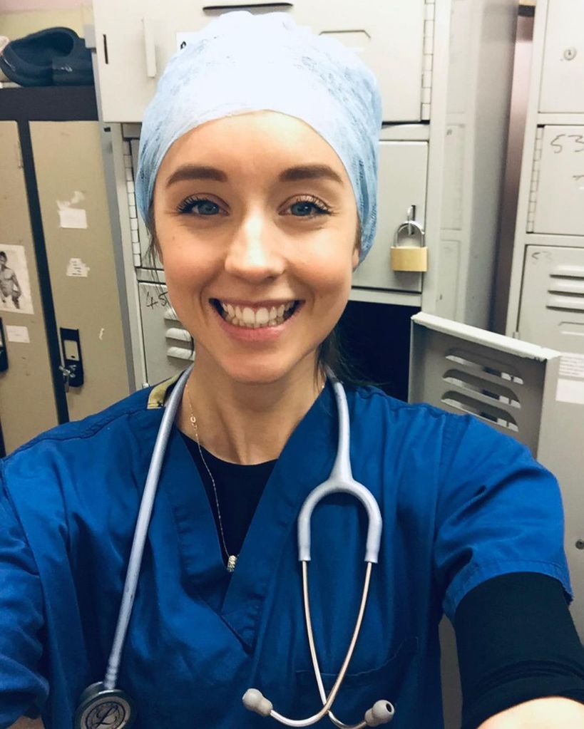 Emily Andre in her doctor's scrubs 