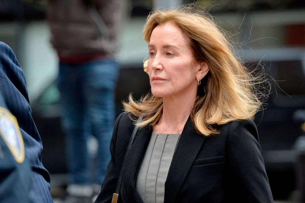 Actress Felicity Huffman is escorted by Police into court where she is expected to plead guilty to one count of conspiracy to commit mail fraud and honest services mail fraud before Judge Talwani at John Joseph Moakley United States Courthouse in Boston, Massachusetts, May 13, 2019. (Photo by Joseph Prezioso / AFP)        (Photo credit should read JOSEPH PREZIOSO/AFP via Getty Images)