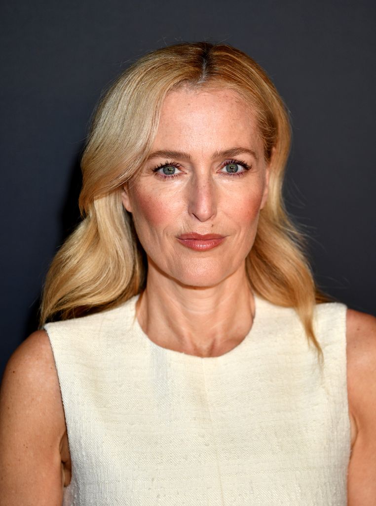 gillian anderson in white dress at the crown celebration 