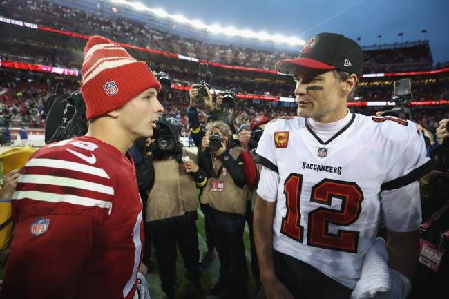 Tom Brady speaking with 49ers QB Brock Purdy after a game