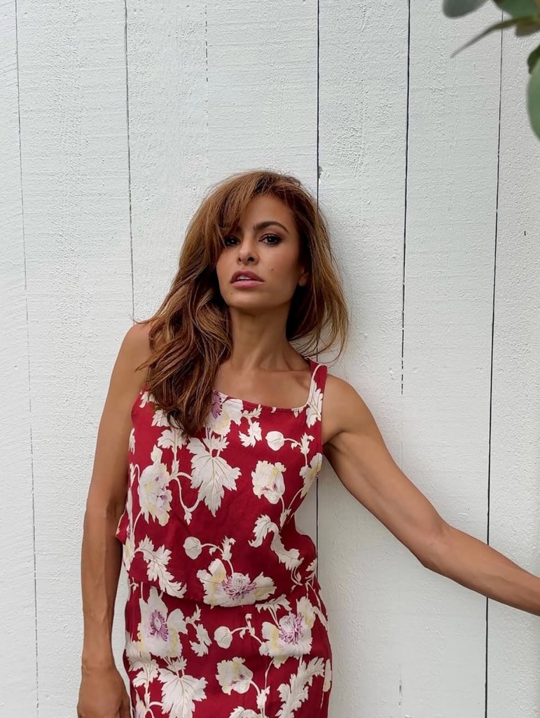 Photo shared by Eva Mendes on Instagram memorial Day Weekend 2025 of herself in a red floral dress