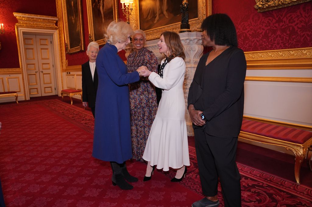 Queen Camilla greets Royal Commonwealth Society Ambassador Geri Halliwell-Horner, during a reception to celebrate the winners of the Queen's Commonwealth Essay Competition at St James's Palace on November 20, 2025 in London, England.