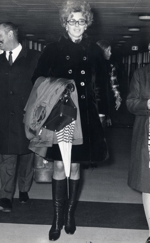 Princess Georgina walking in a black coat