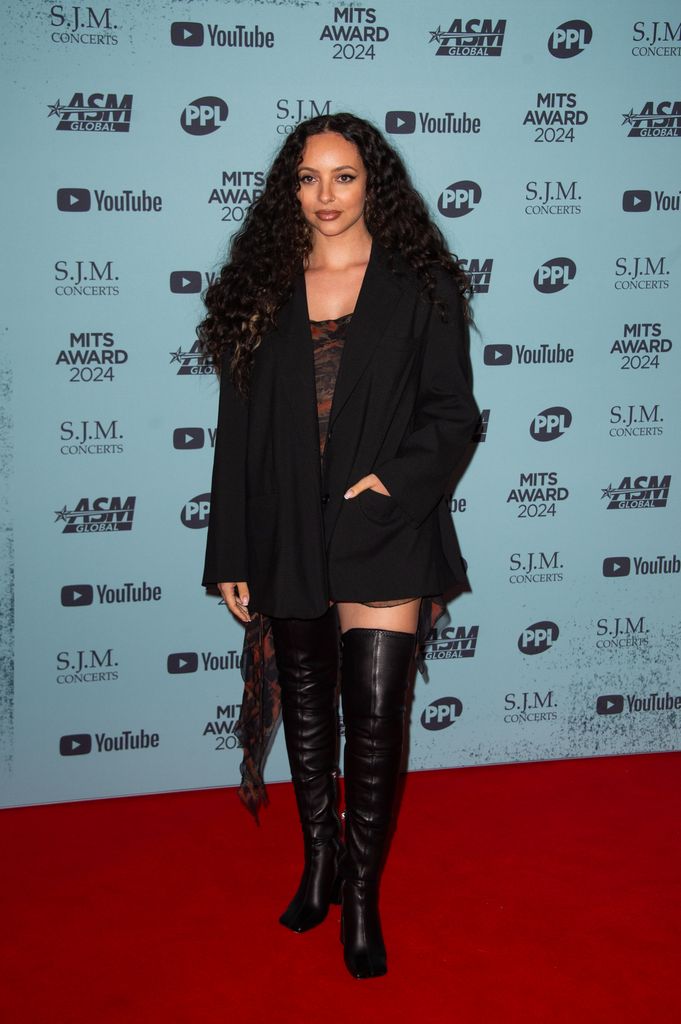 Jade Thirlwall on red carpet in over knee boots and mini dress