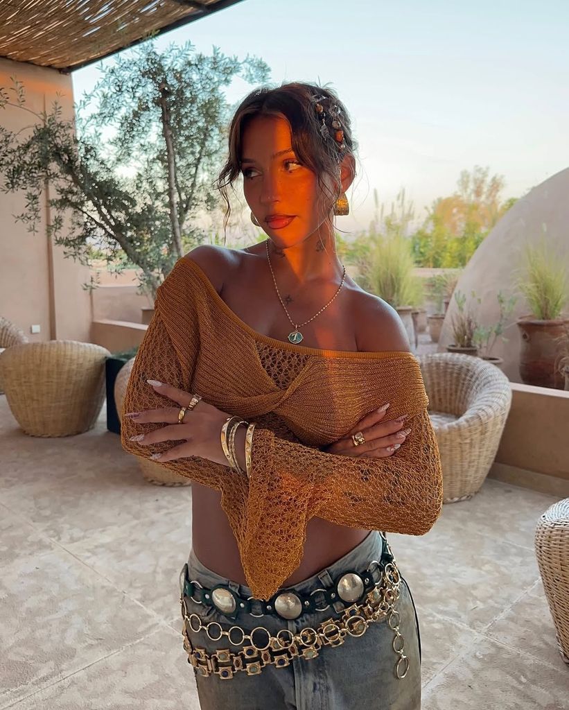 @badkidhq in orange crochet top
