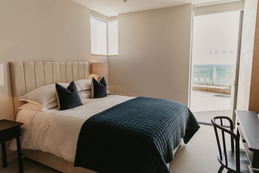 Blue lodge bedroom at Clifftops on Pennsylvania Castle Estate