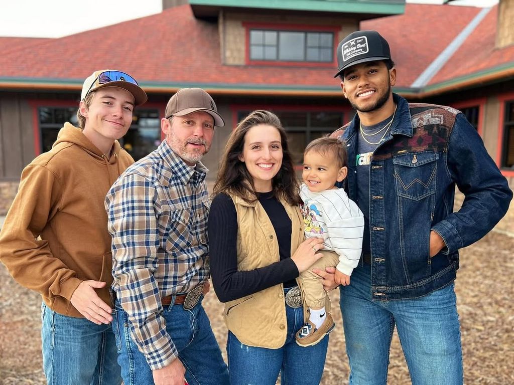 Brandon Blackstock poses for a photo with his grandchild and his two children Seth and Savannah Blackstock, shared on Instagram