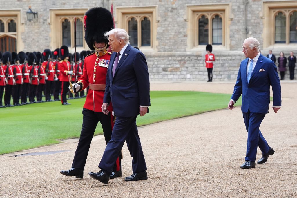 King Charles III (R) and US President Donald Trump review the guard of honour during the ceremonial welcome during the State visit by the President of the United States of America on September 17, 2025 in Windsor, England
