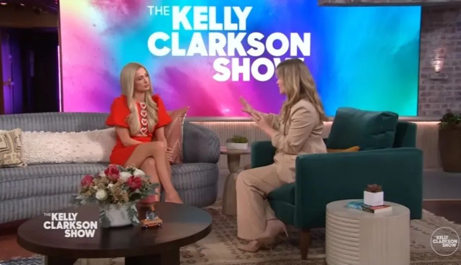 Kelly stunned in a nude pant suit