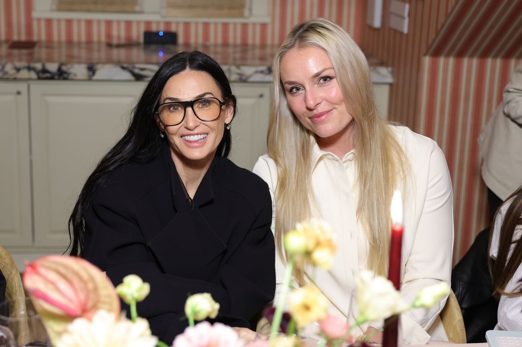 Demi smiling with friend looking very youthful