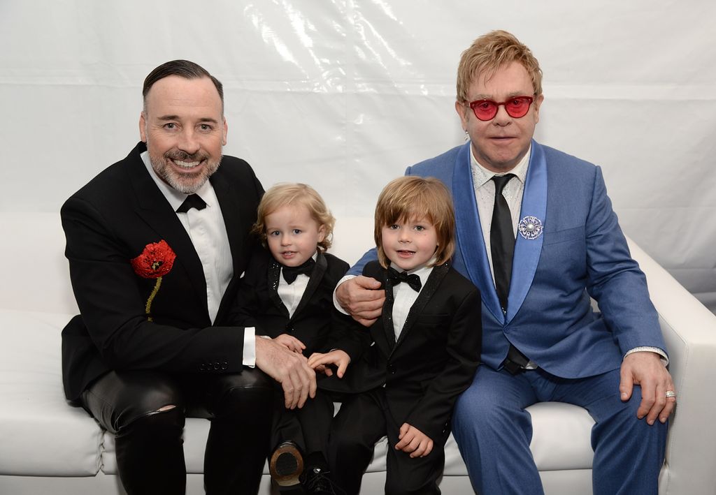 The singer with his husband David Furnish and their two sons 