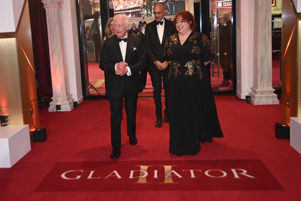 King Charles walking with a woman