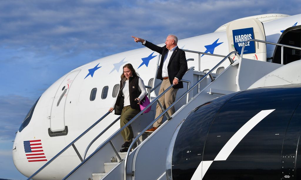 Tim Walz points as he exits the plane with his daughter Hope. Democratic Vice Presidential nominee Governor Tim Walz spoke at the Scranton Cultural Center ahead of the November 5 election.