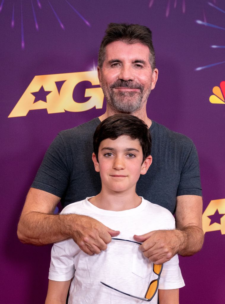 Simon Cowell with his arms around son Eric