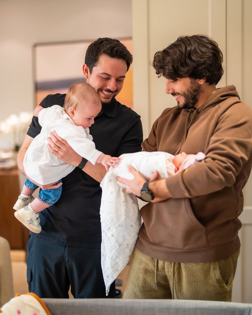 Crown Prince Hussein with baby Iman and her cousin Amina